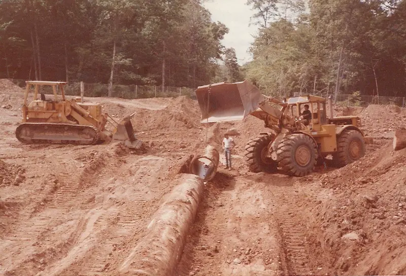 Crawler tractor and pipe trench on a Grabowski sitework job.