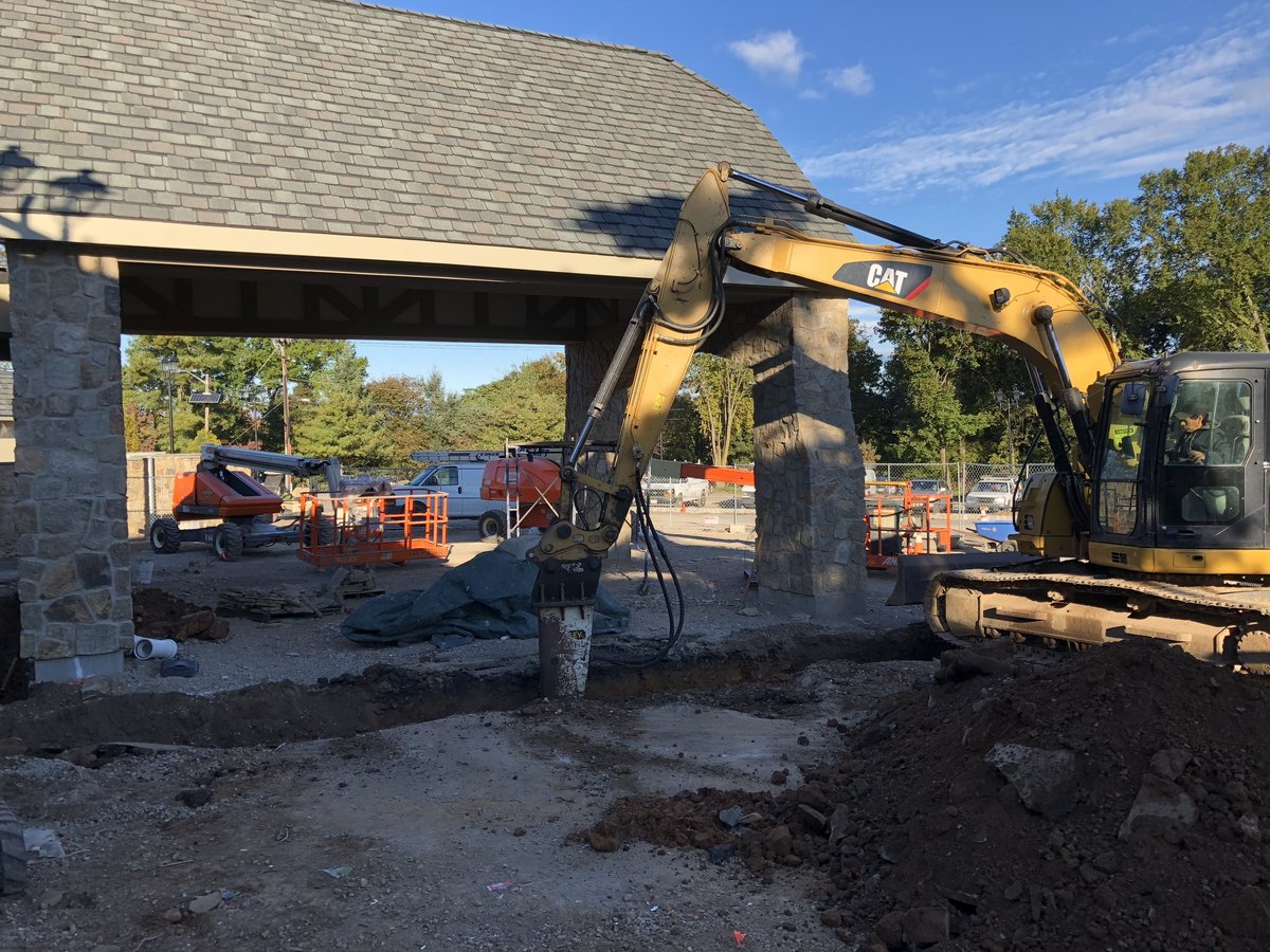 Hydraulic hammer and excavator at the entry of Crestmont.